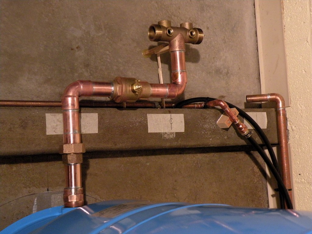 Photo: a brass shut-off valve on a copper pipe